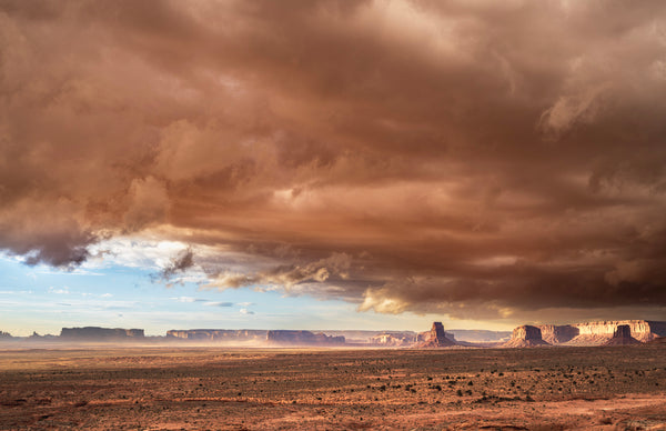 Desert landscape with large storm clouds in the sky